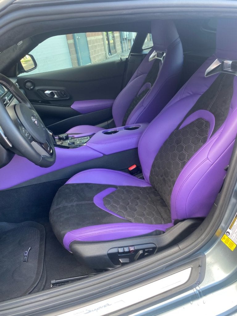 purple and black custom interior detailing, both seats and center console